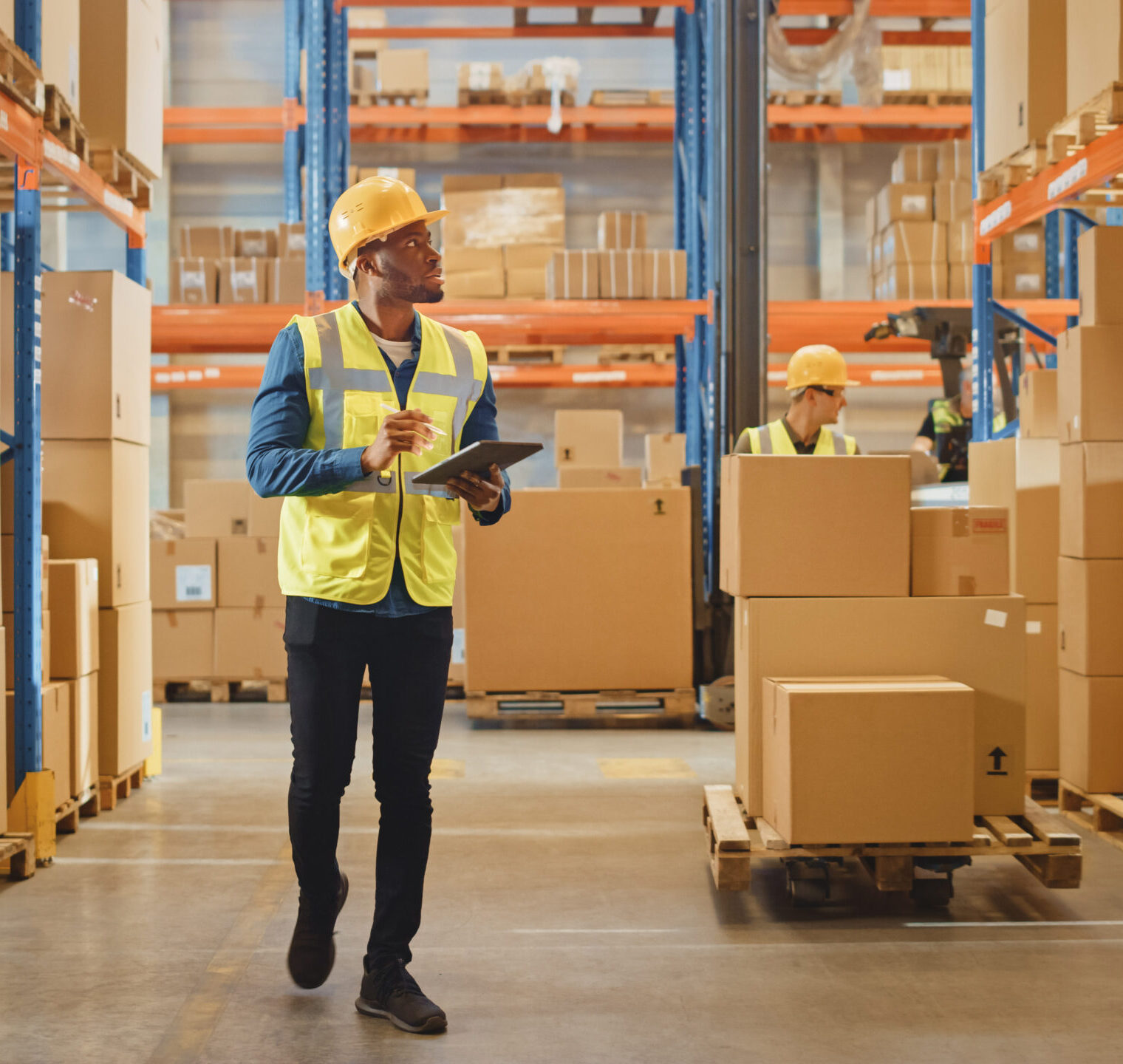 Employee walking around warehouse